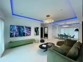 4 Bedroom House for Rent at Casa Jomtien living room with blue mood lighting and modern artwork
