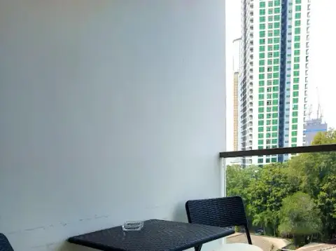 1 Bedroom Condo for Sale at Laguna Beach Resort 1 private balcony with seating and city skyline view