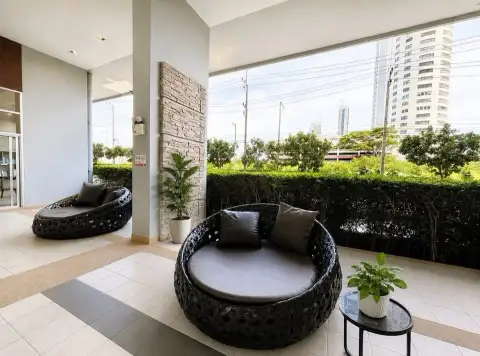 1 Bedroom Condo for Rent at Lumpini Park Beach Jomtien outdoor lounge area with round daybeds and city view
