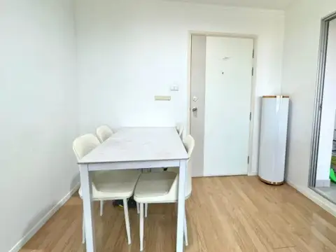 1 Bedroom Condo for Sale at Lumpini Ville Naklua-Wongamat entryway with dining table and front door