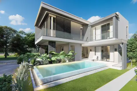 Luxury Vista Villas front view of a modern villa with a two-car garage and tropical plants.