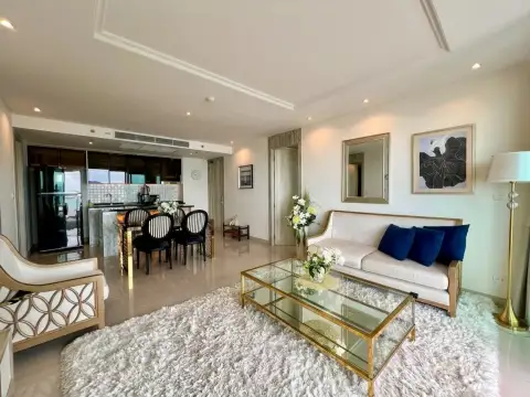 2 Bedroom Condo for Sale at Riviera Monaco living room with plush rug, sofa, and kitchen view