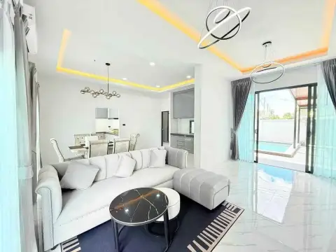 3 Bedroom House for Rent in Mabprachan open living space with sliding glass doors leading to pool view