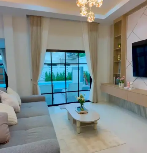 3 Bedroom House for Sale in Mabprachan showing bright living room with pool view through glass doors
