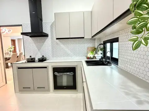 3 Bedroom House for Sale in Mabprachan modern kitchen with black oven and hexagon tile backsplash