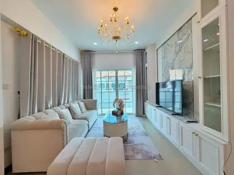 3 Bedroom House for Rent in Mabprachan cozy lounge with cream sofa and garden view window