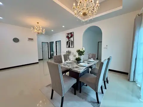 3 Bedroom House for Rent in Mabprachan dining area with six-seat table and chandelier lighting