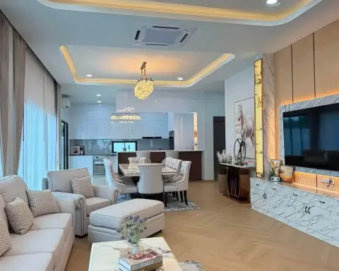 4 Bedroom House for Sale in Mabprachan open-plan living room with kitchen, TV wall unit, and marble accents