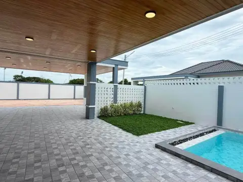 4 Bedroom House for Sale in Mabprachan covered carport area beside a small plunge pool and artificial lawn