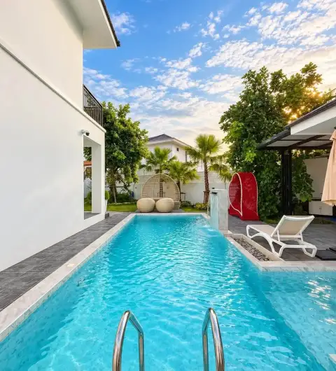 6 Bedroom House for Rent in Mabprachan featuring lap pool with water fountain feature and tropical garden