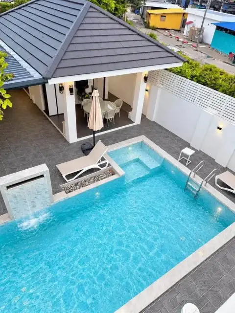 6 Bedroom House for Rent in Mabprachan aerial view of pool, jacuzzi corner, and covered patio lounge