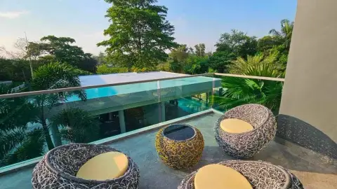 6 Bedroom House for Rent in Mabprachan rooftop terrace seating overlooking pool and lush greenery