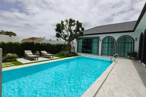 5 Bedroom House for Sale in Mabprachan curved sofa lounge with sheer curtains and natural light