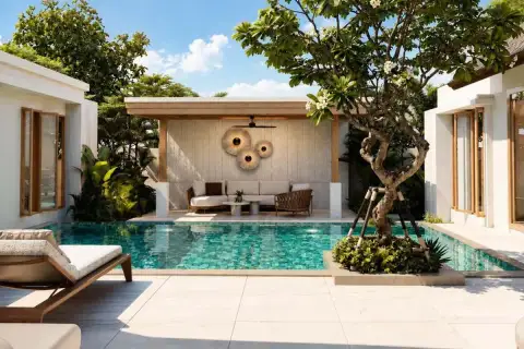 Mirama Pattaya outdoor private pool with shaded lounge pavilion, sun lounger, and frangipani tree
