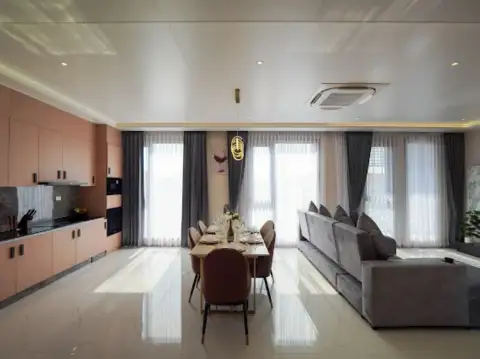 5 Bedroom House for Sale & Rent in Na Jomtien open-plan dining area and kitchen with modern peach cabinetry