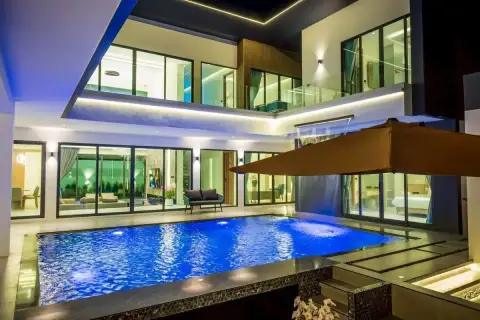 7 Bedroom House for Sale & Rent at Nagawari Pattaya illuminated pool and waterfall feature at night