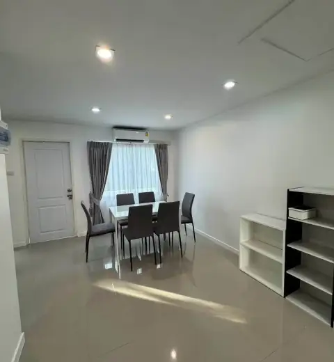3 Bedroom House for Rent in Na Kluea dining area with glass table, chairs, and storage shelves