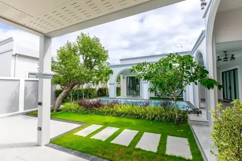 4 Bedroom House for Sale in Nong Prue with lush garden, stepping stone path and pool view