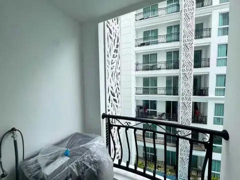 1 Bedroom Condo for Sale at Olympus City Garden balcony view overlooking pool and building facade