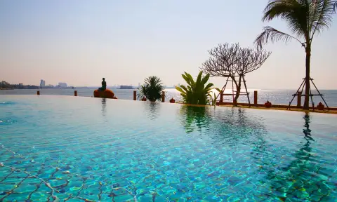 Paradise Ocean View: Well-equipped fitness center with treadmills, exercise bikes, and dumbbell rack.