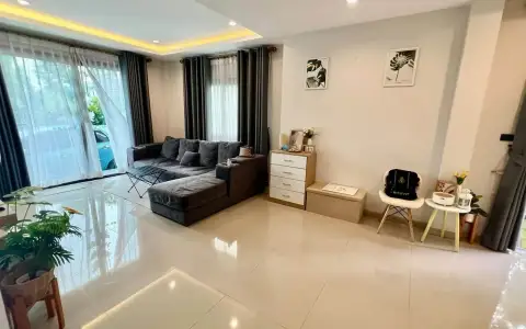 3 Bedroom House for Sale at Patta Define spacious living room with sectional sofa and sheer curtains