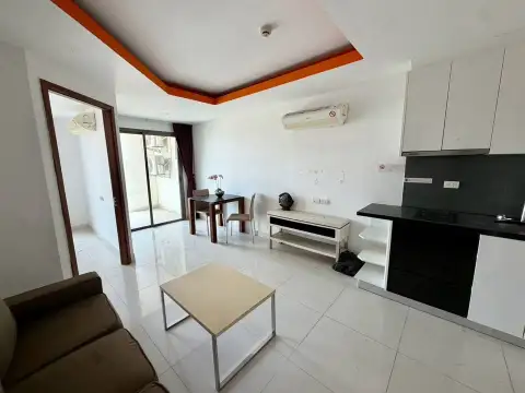 1 Bedroom Condo for Sale at C View Residence 2 open-plan living area with kitchen counter and dining space