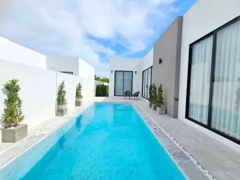 3 Bedroom House for Sale in Pong private pool with white modern villa facade and potted plants