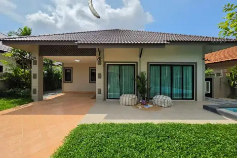 Pattaya paradise village 1 covered patio with bean bag seating and sliding glass doors