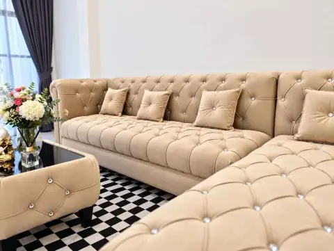 3 Bedroom Townhouse for Rent in Central Pattaya close-up of tufted beige sectional sofa with crystal buttons