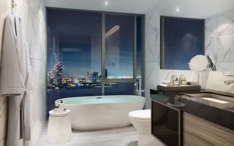 2 Bedroom Condo for Sale at The Panora Pattaya marble bathroom with soaking tub and city skyline view