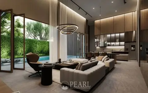 Baan Mae Residence 69 spacious living room with high ceilings, large windows, and contemporary furniture.