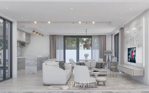 M Estate modern white house exterior with black-framed windows and a fenced yard.