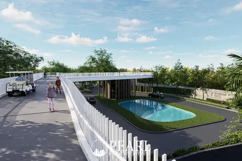 Wisdom First Residences elevated walkway and main entrance with a decorative pond and lush landscaping.