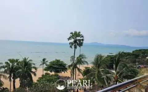 Baan Haad Uthong Condominium panoramic ocean view from a balcony with sandy beach and palm trees.