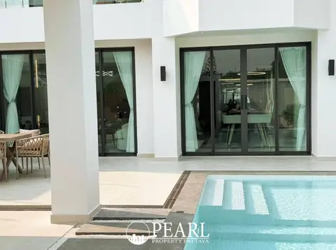 View Point Village outdoor patio with dining set next to a private swimming pool.