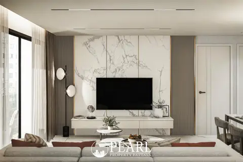 2 Bedroom Condo for Sale at Avenue Boutique Pattaya living room with wall-mounted TV and marble accent wall