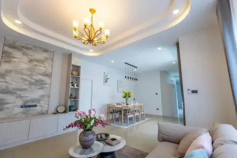 3 Bedroom House for Sale at Phonthep Garden Ville 2 dining room with large wood table eight chairs and pendant lights