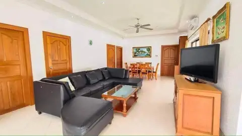 3 Bedroom House for Rent in Jomtien spacious living area with sectional sofa and dining table