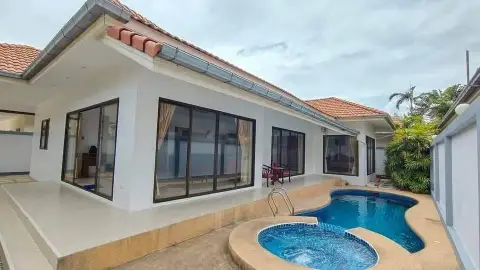 3 Bedroom House for Rent in Jomtien exterior view of house with tiled roof, patio, and private pool