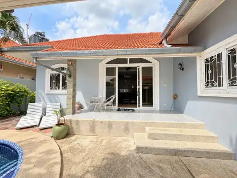 3 Bedroom House for Rent in Pratumnak Hill rear patio with glass doors, seating area and pool steps