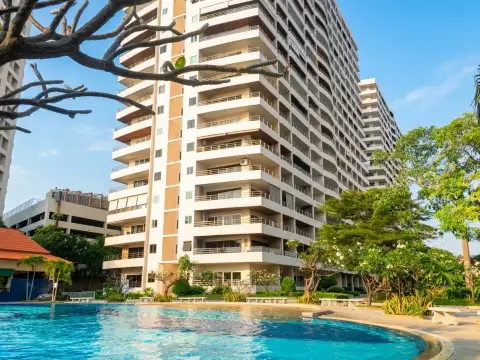 View Talay 3A high-rise condo tower with balconies overlooking resort swimming pool