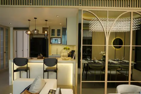 3 Bedroom Condo for Sale at SKYPARK Lucean Jomtien Pattaya open kitchen with marble bar counter and view into dining area