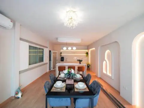 3 Bedroom House for Sale at Raviporn City Home dining area with table setting and decorative arched wall niches