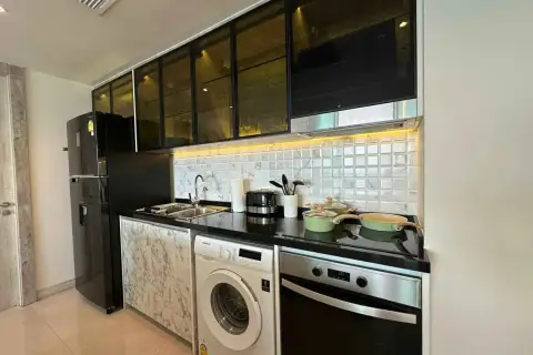 2 Bedroom Condo for Rent at Riviera Monaco kitchen with built-in oven, washing machine and glass cabinets