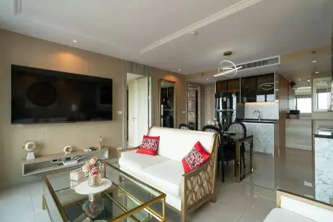 2 Bedroom Condo for Sale at Riviera Monaco open-plan living room with white sofa and marble kitchen