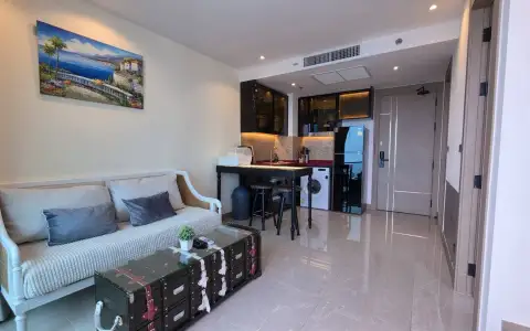 1 Bedroom Condo for Rent at Riviera Ocean Drive sofa, dining table, and compact kitchen near entrance