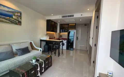 1 Bedroom Condo for Rent at Riviera Ocean Drive open-plan living space with kitchenette and front door