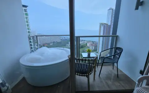 1 Bedroom Condo for Rent at Riviera Ocean Drive private balcony bathtub with ocean and city skyline view