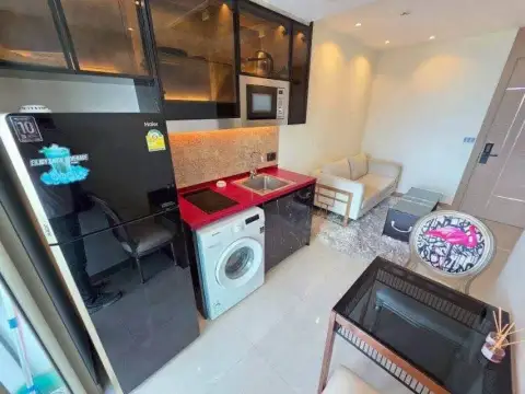 1 Bedroom Condo for Sale at Riviera Ocean Drive overhead view of kitchenette, sofa and entry door