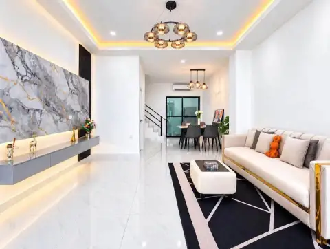 2 Bedroom Townhouse for Rent in East Pattaya open-plan living and dining space with marble feature wall